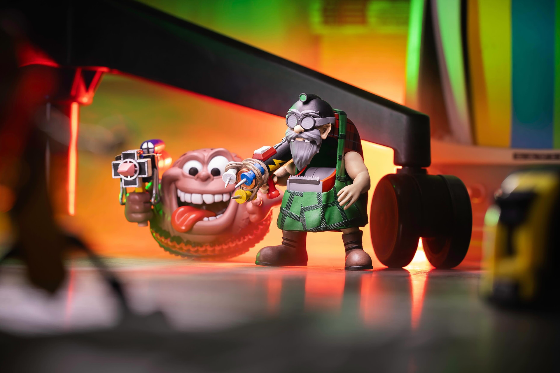 Two 9 to 5 Warriors figures posed in a neon-lit office diorama